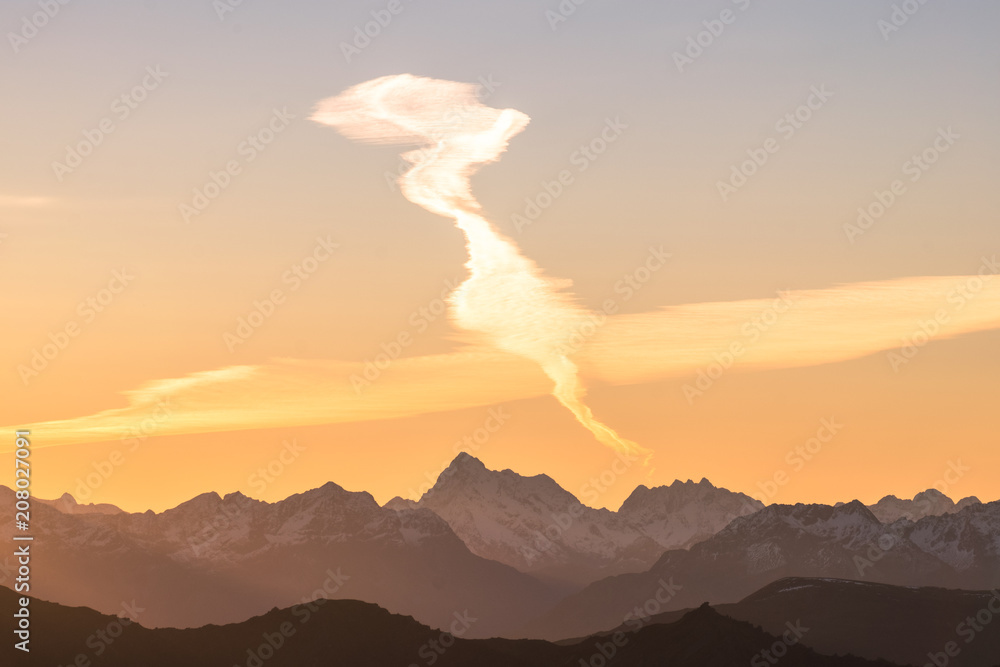 Poster A stunning scene of sunset on the top of Alps mountain.