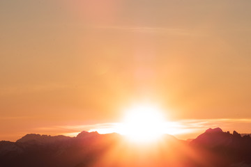 Fototapeta na wymiar A stunning scene of sunset on the top of Alps mountain.