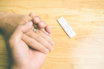 pregnancy tests put on wood table that result is two lines means having baby Vintage tone