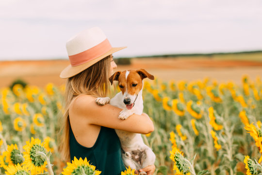 Caucasian woman enjoying summer time at sunflowers field