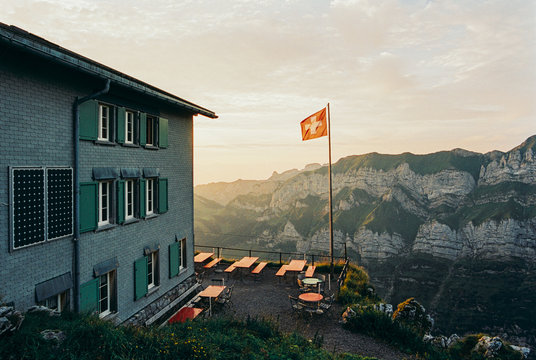 Swiss Flag Blowing in Wind in Warm Morning Light Shot on Film