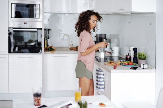 Woman preparing lunch in kitchen