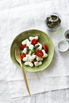 Caprese salad with heart shaped mozzarella cheese