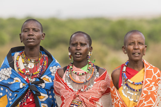 Women of the Maasai tribe singing in their village