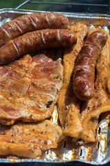 Unhealthy but tasty grilled sausages and meat