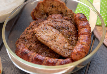 Unhealthy but tasty grilled sausages and meat