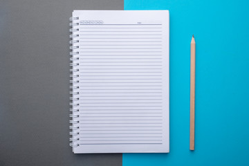 Blank picture frame on white table and white wall