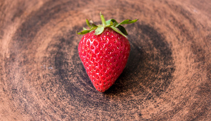 ripe juicy red strawberry on a plate