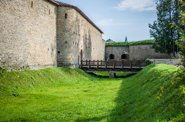 City wall of Hermann Castle. Bridge to the fortress through the moat. Narva. Estonia.