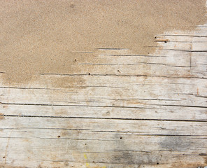 Fototapeta na wymiar Sand on planked wood. Summer background with copy space. Top view