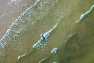 Ariel view of Fishermen are searching for aquatic animals in the Hua Hin beach, Thailand.
