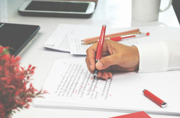 proofreading paper on table