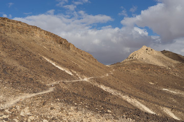Trekking in Negev dramatic stone desert, Israel