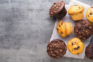 Obraz na płótnie Canvas Homemade chocolate muffins on the vintage background.