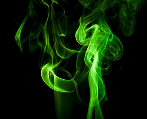 Green smoke on black background