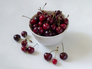 Cherries in a white Cup