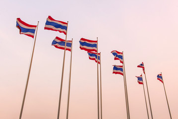 Thai flags waving at sunset time in Thailand