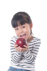 portrait of a little girl eating apple