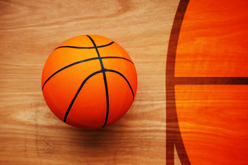 Naklejka premium Basketball ball on court floor