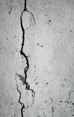 old plastered wall with a crack in it