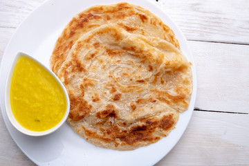 Roti canai or paratha with dhal