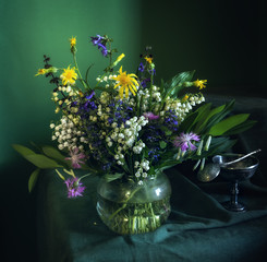 still life with wildflowers. spring motley grass.
