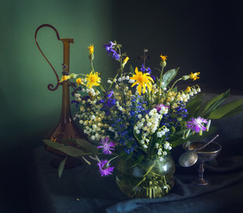 still life with wildflowers. spring motley grass.