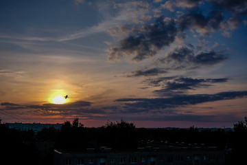 dramatic sunset over the city rooftops