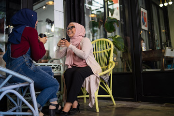 muslim malay woman is having a tea