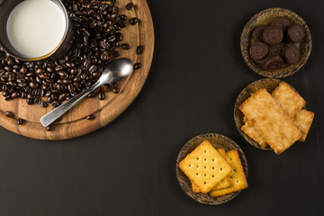 Pictures of coffee beans and snack on wooden backdrop You can decorate it in cafes, equipment,...