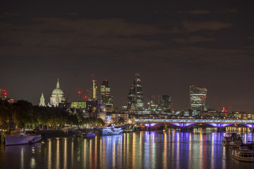 london skyline and river thames at night