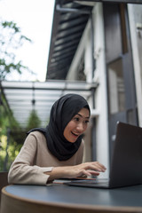 a muslim girl is doing some work