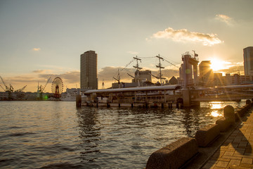 The Port of Kobe is a Japanese maritime port in Kobe,  Japan with a lot of building and nice landscape with clear sky	