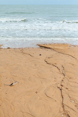 Curved sea beach with the sea
