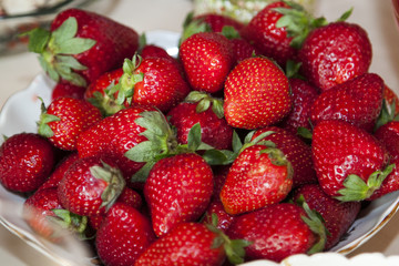 close up view of strawberries in a plate