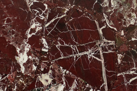The red marble. Texture.