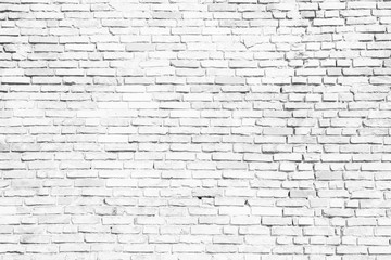 Simple white and grey brick wall as seamless pattern texture background.