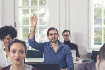 Young Businessman Rasing Hand