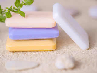 four bars of soap on a towel