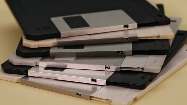 3.5 inch computer floppy disks in a stack - vintage technology, camera slow slide