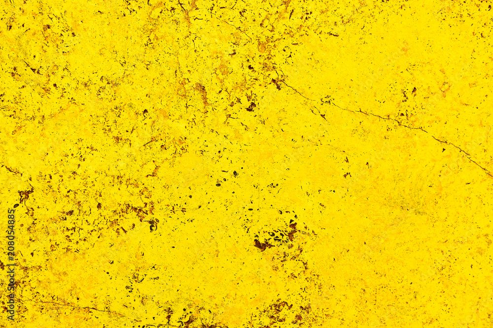 Poster vivid bright yellow color facade stone wall with imperfections and cracks as an empty rustic and sim