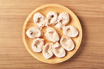 Fish dumplings on wooden plate