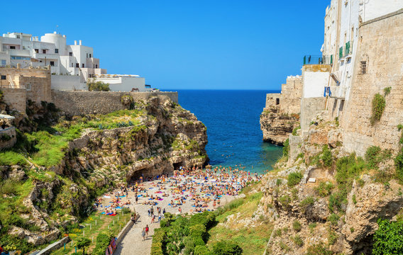 View of the beach lama monachile cala porto in the italian city Polignano. Polignano a Mare, Bari Province, Puglia, southern Italy.