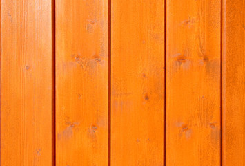 Orange painted wooden wall plank texture background.