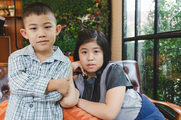 Portrait asian young girl and boy in restaurant shop