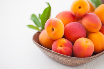 fresh apricots on white background