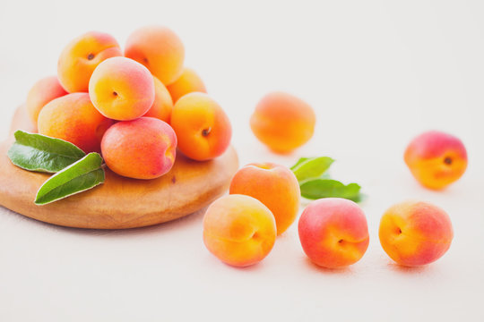 fresh apricots on white background