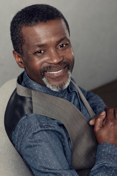 portrait of handsome smiling african american man in waistcoat