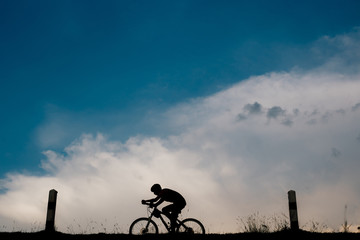 Obraz premium Ride on bike on the road. Sport and active life concept in the summer time