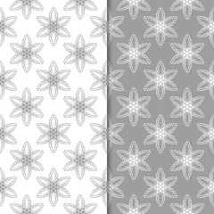 White and gray floral backgrounds. Set of seamless patterns